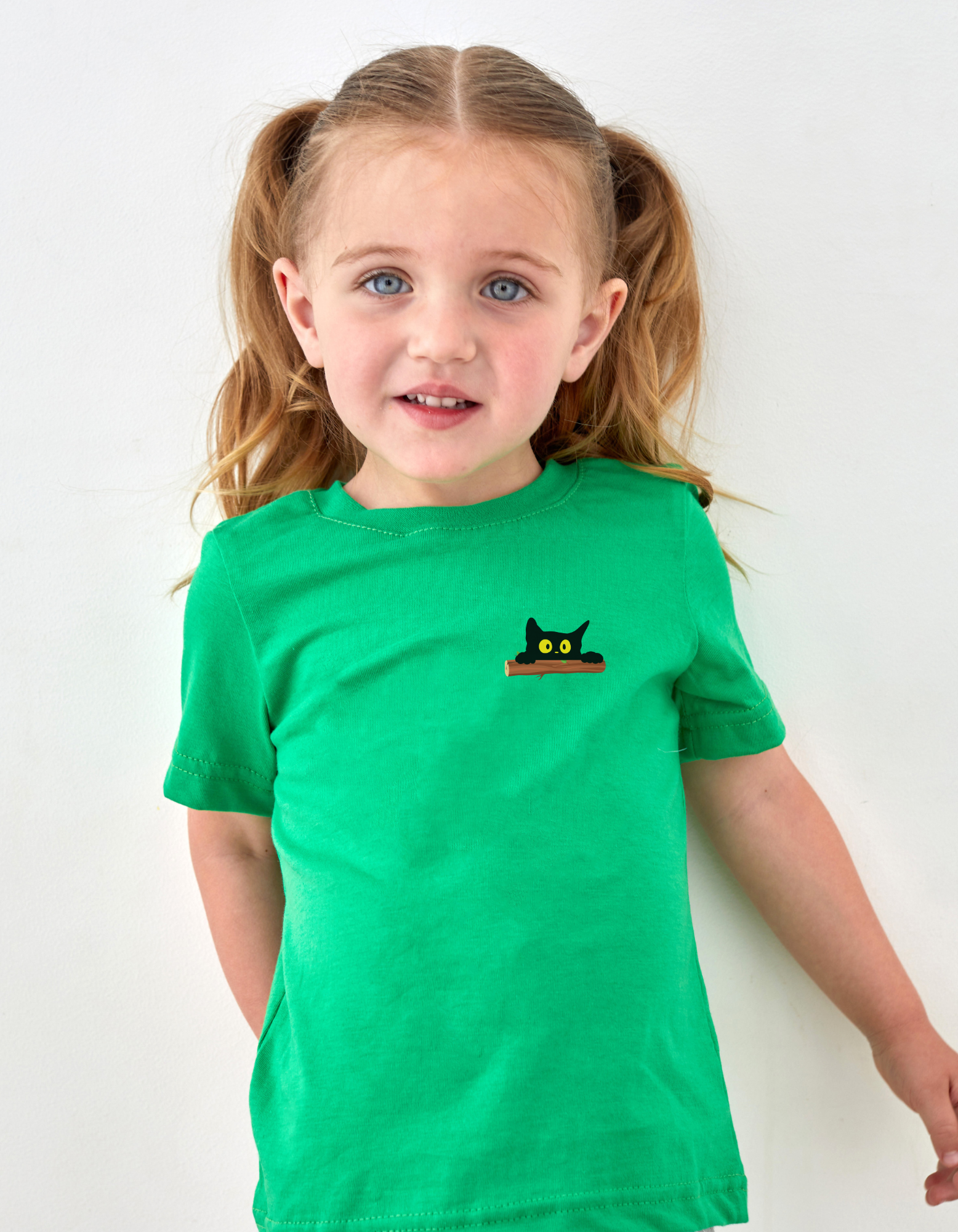 Child wearing Peek-a-Meow cotton T-shirt with cute cat design