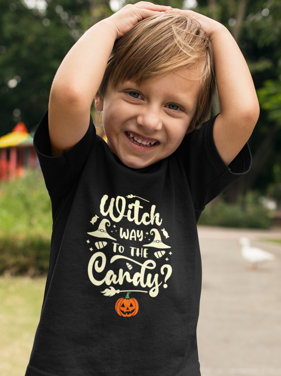 Kids unisex cotton Halloween T-shirt with text “Witch Way to the Candy” print