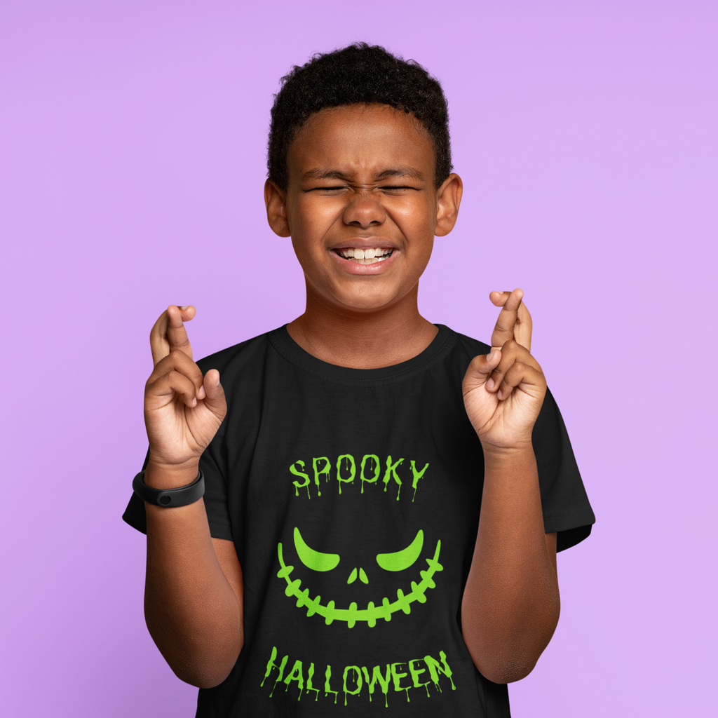 Kids unisex cotton Halloween T-shirt with spooky smile graphic and text “Spooky Halloween”