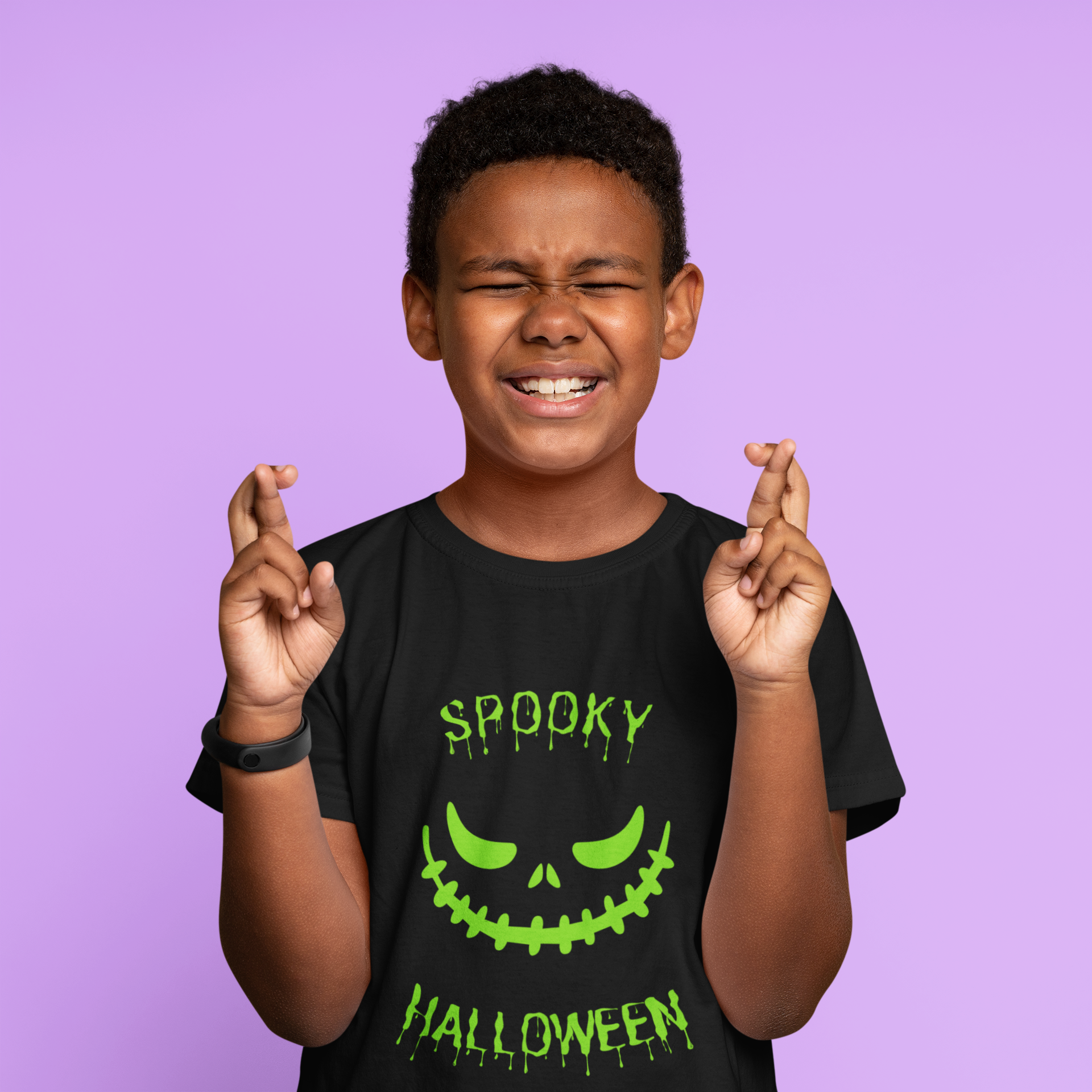 Kids unisex cotton Halloween T-shirt with spooky smile graphic and text “Spooky Halloween”