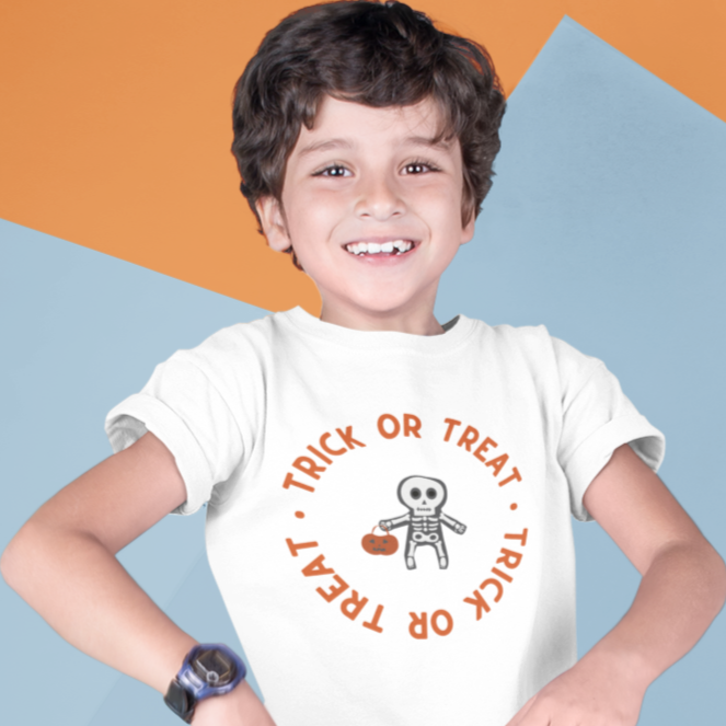 Kids unisex cotton Halloween T-shirt with little skeleton holding pumpkin basket and text “Trick or Treat”