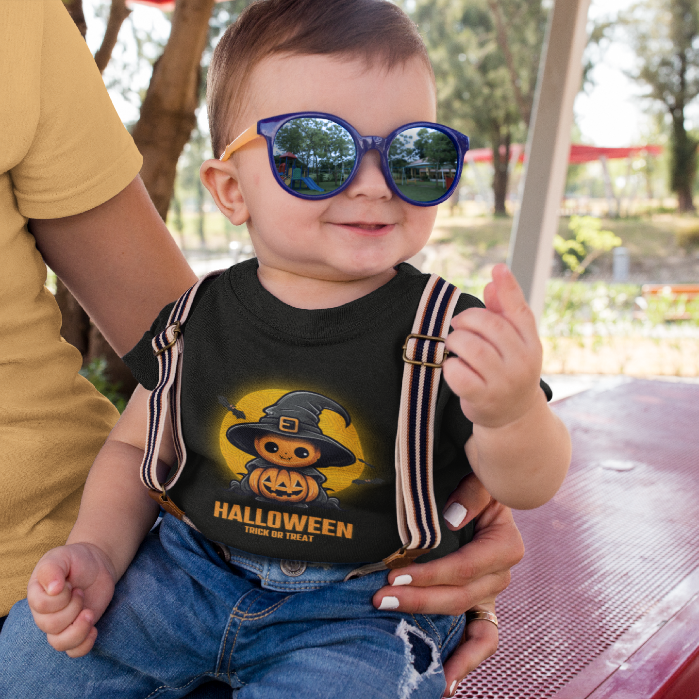 Kids unisex cotton Halloween T-shirt with stacked pumpkins wearing witch hat and “HALLOWEEN” text