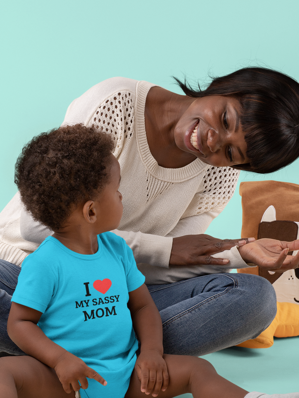 Baby wearing cotton onesie with “I Love My Sassy Mom” print by Mumma’s Cub