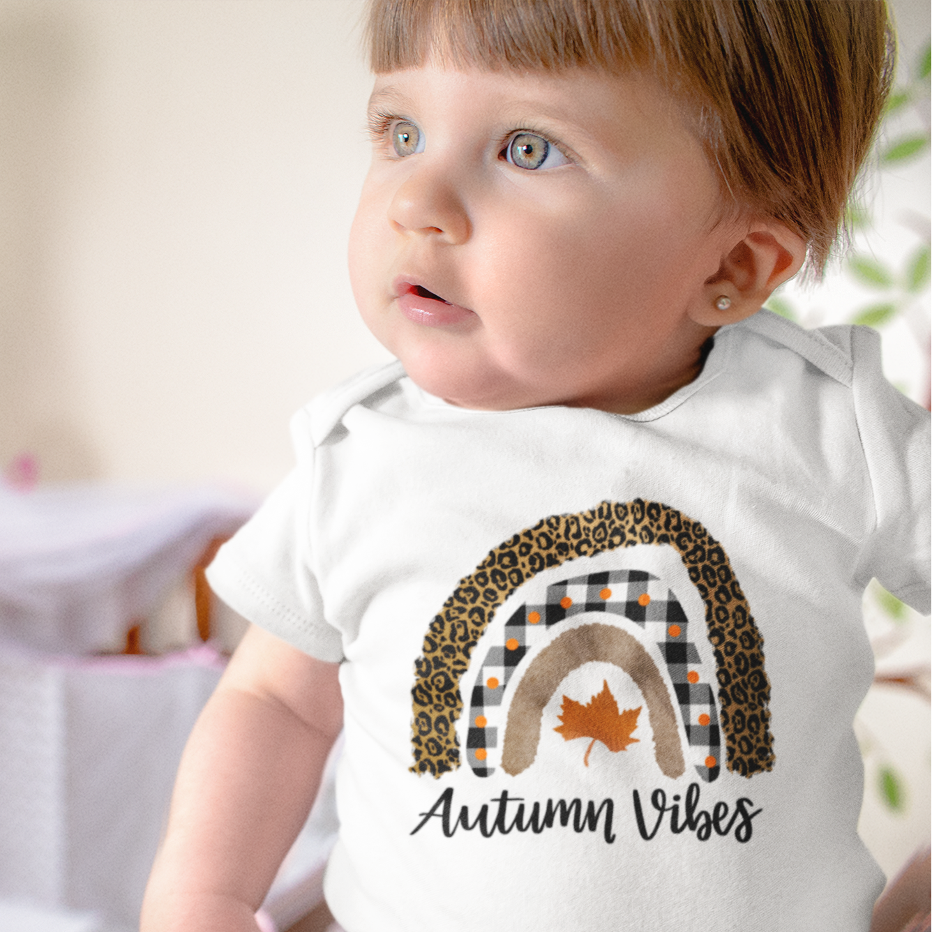 Baby soft cotton Halloween romper with boho rainbow print and text “Autumn Vibes”