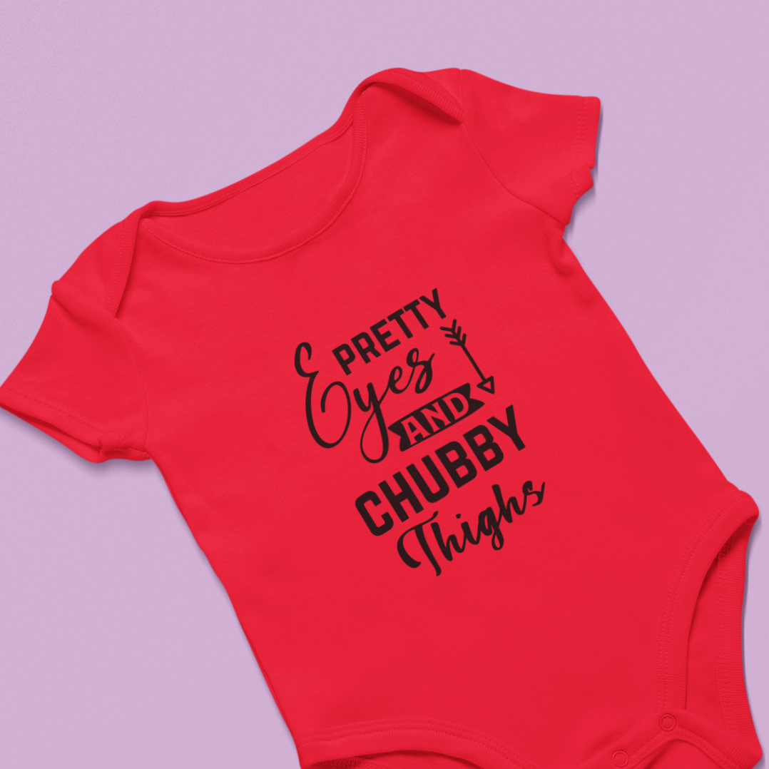 Premium cotton baby romper with quote “Pretty eyes and chubby thighs” – soft unisex onesie for newborns and infants