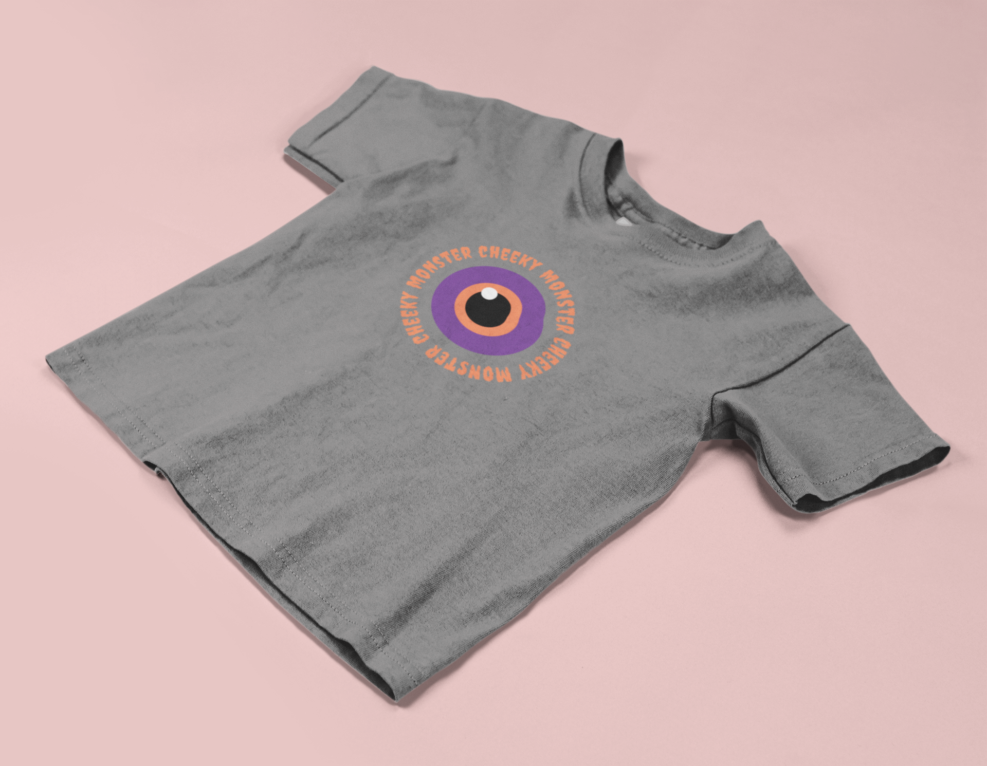 Orange and purple evil eye graphic with Cheeky Monster text on kids cotton T-shirt