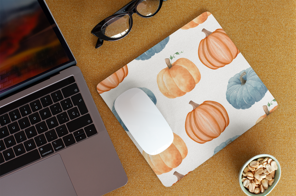 Mouse pad with three colorful pumpkin prints, stitched edges, and anti-slip base for smooth and precise use
