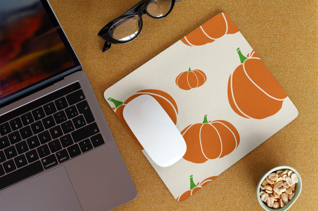 Orange pumpkin print mouse pad with stitched edges, anti-slip backing, and smooth surface for precision use