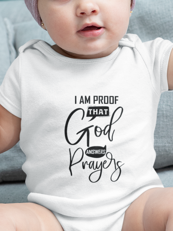 Baby wearing super combed cotton romper with “I am proof that God answers prayer” quote by Mumma’s Cub