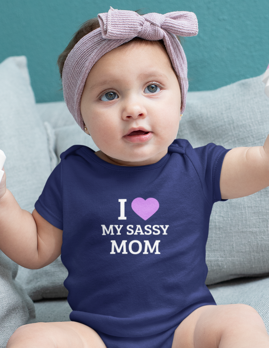 Baby wearing cotton onesie with “I Love My Sassy Mom” print by Mumma’s Cub
