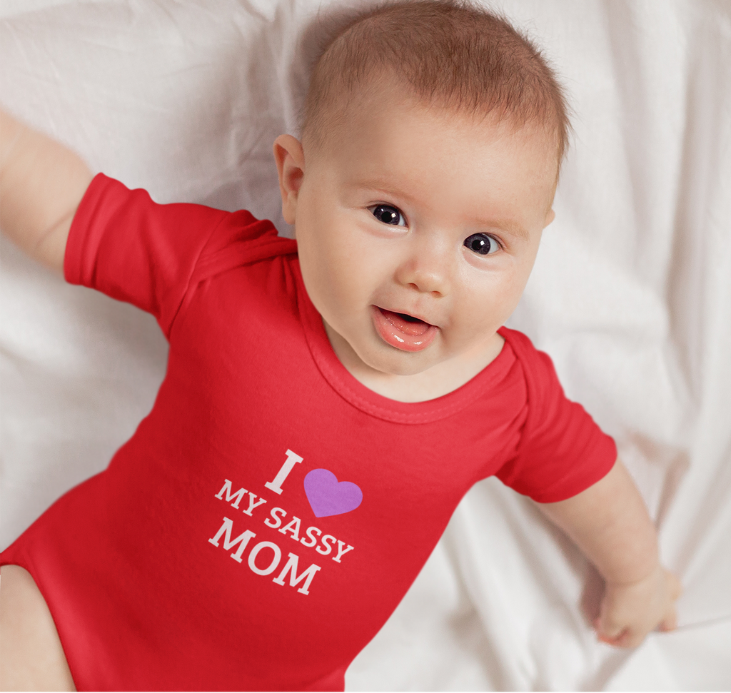 Baby wearing cotton onesie with “I Love My Sassy Mom” print by Mumma’s Cub
