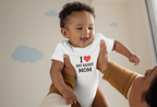 Baby wearing cotton onesie with “I Love My Sassy Mom” print by Mumma’s Cub