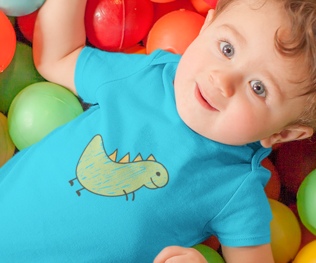 Baby wearing scribbled dinosaur print cotton onesie by Mumma’s Cub