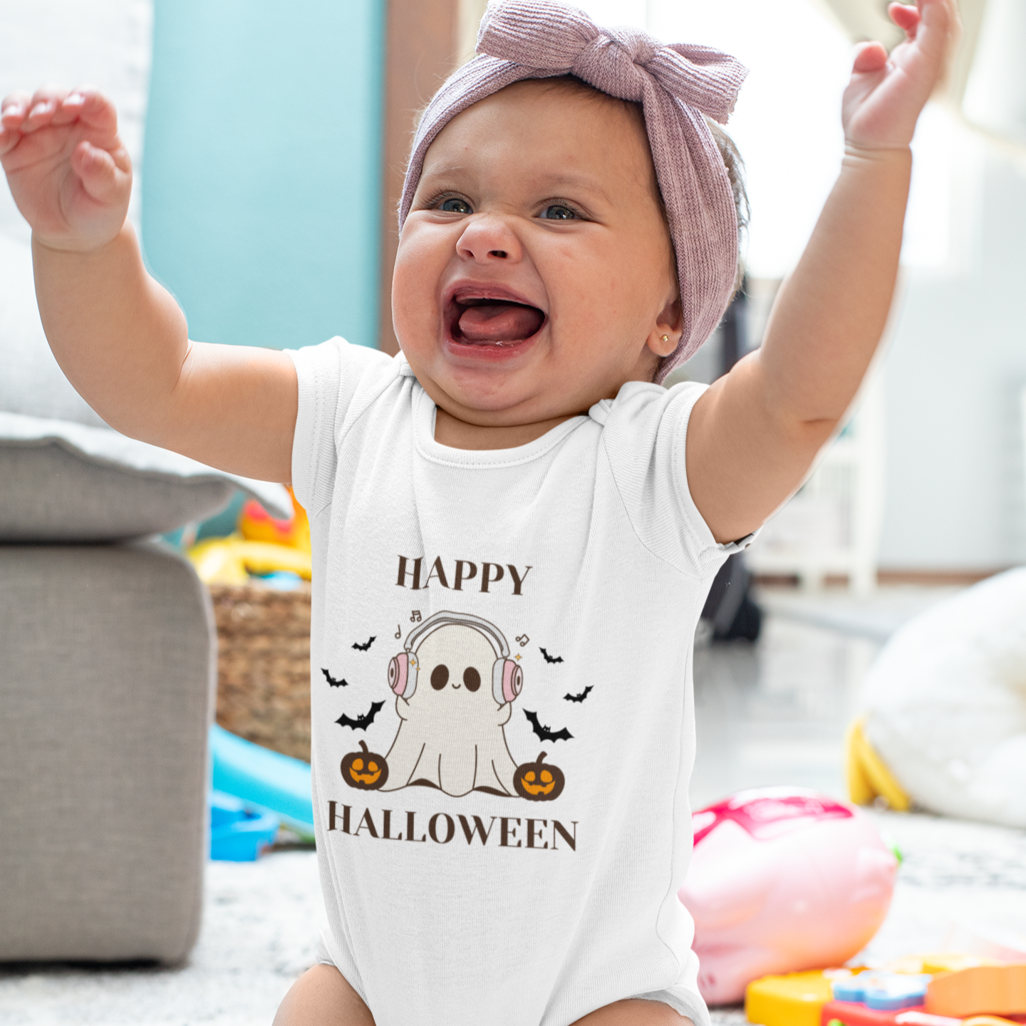 Baby soft cotton Halloween romper with ghost wearing headphones and text “Happy Halloween”