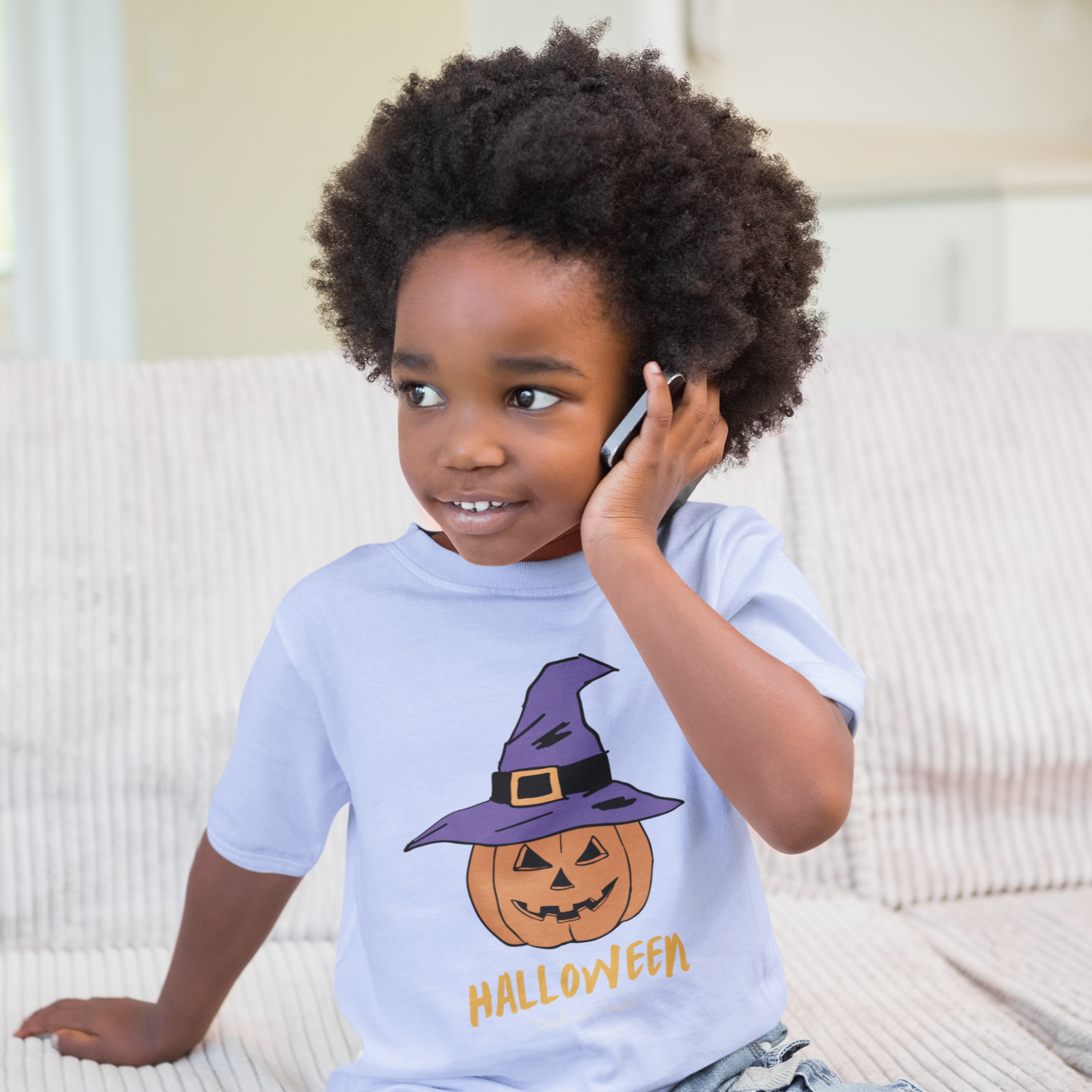 Kids unisex cotton Halloween T-shirt with pumpkin wearing witch hat and text “Halloween”