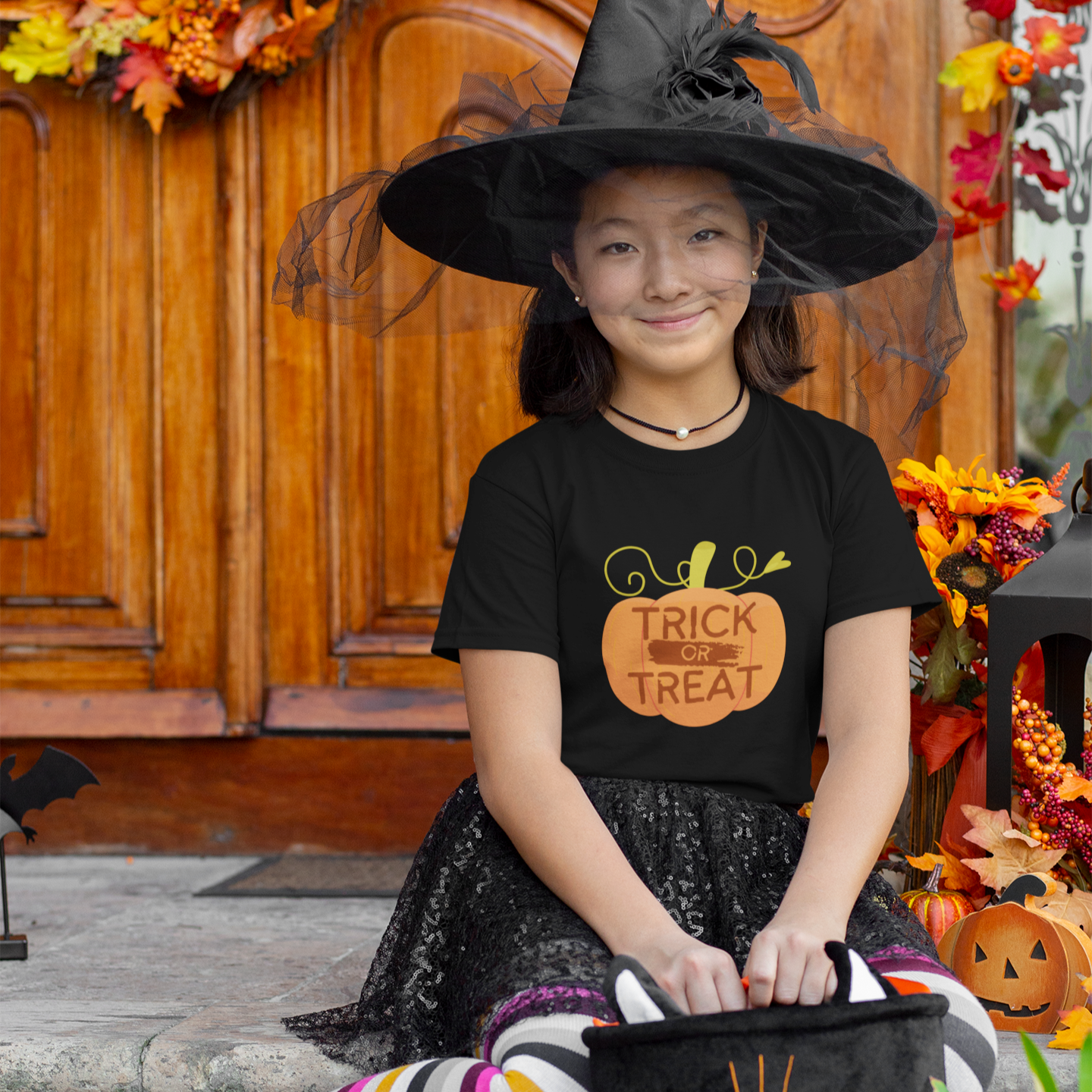 Kids Halloween T-shirt with pumpkin print and text “Trick or Treat”
