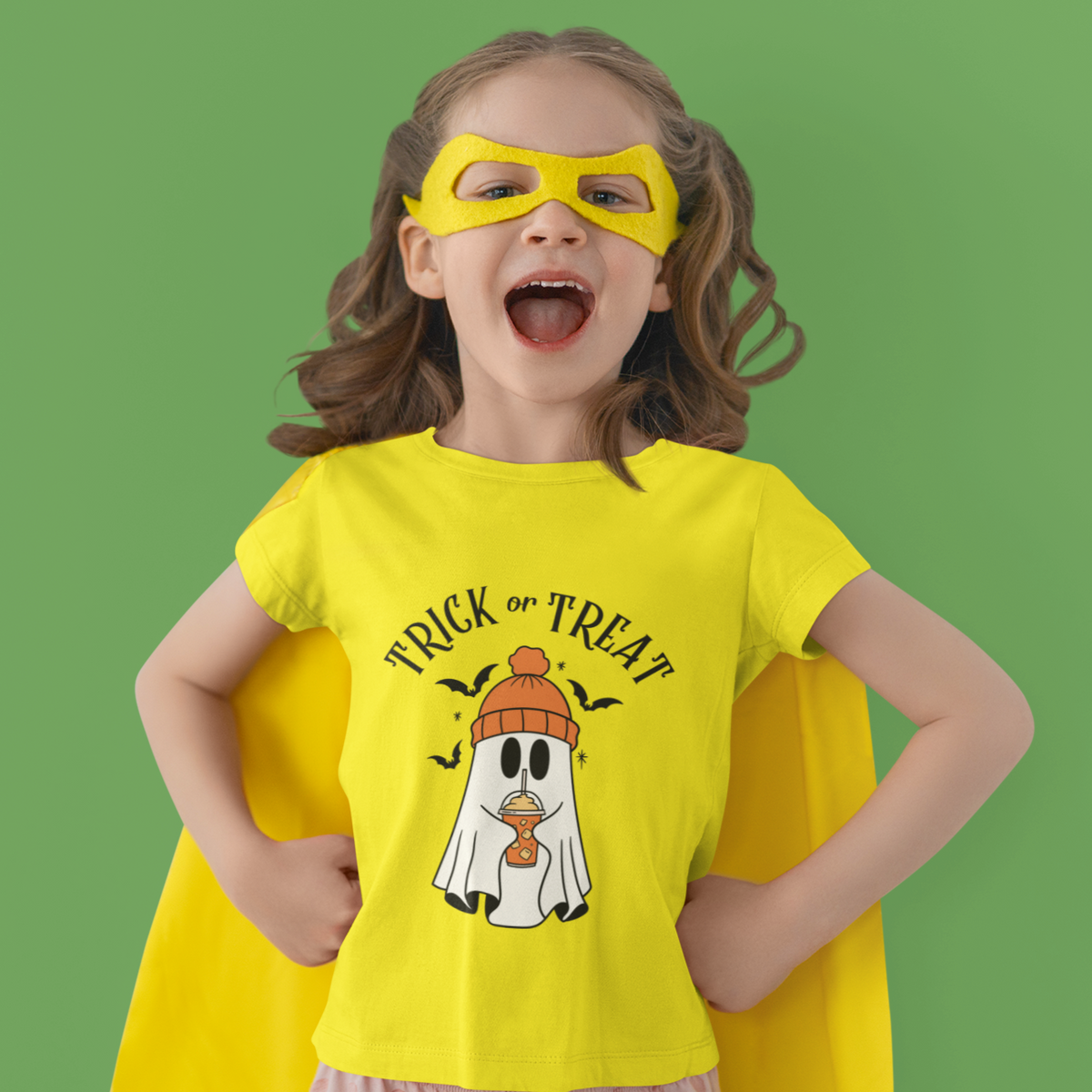 Kids unisex cotton Halloween T-shirt with cute ghost wearing winter cap, holding frappe, and text “Trick or Treat”