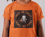 Young girl wearing an orange 'Trick or Treat' shirt with a skeleton design.