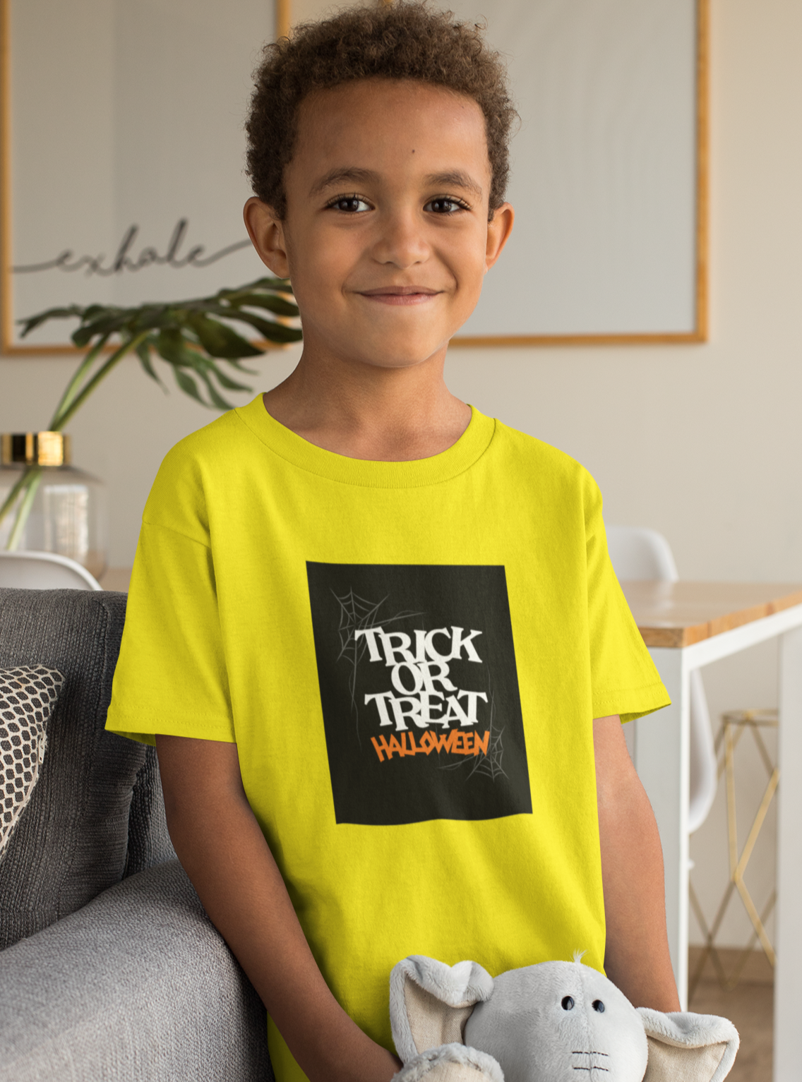 Kids unisex cotton Halloween T-shirt with spider web print and text “Trick or Treat”