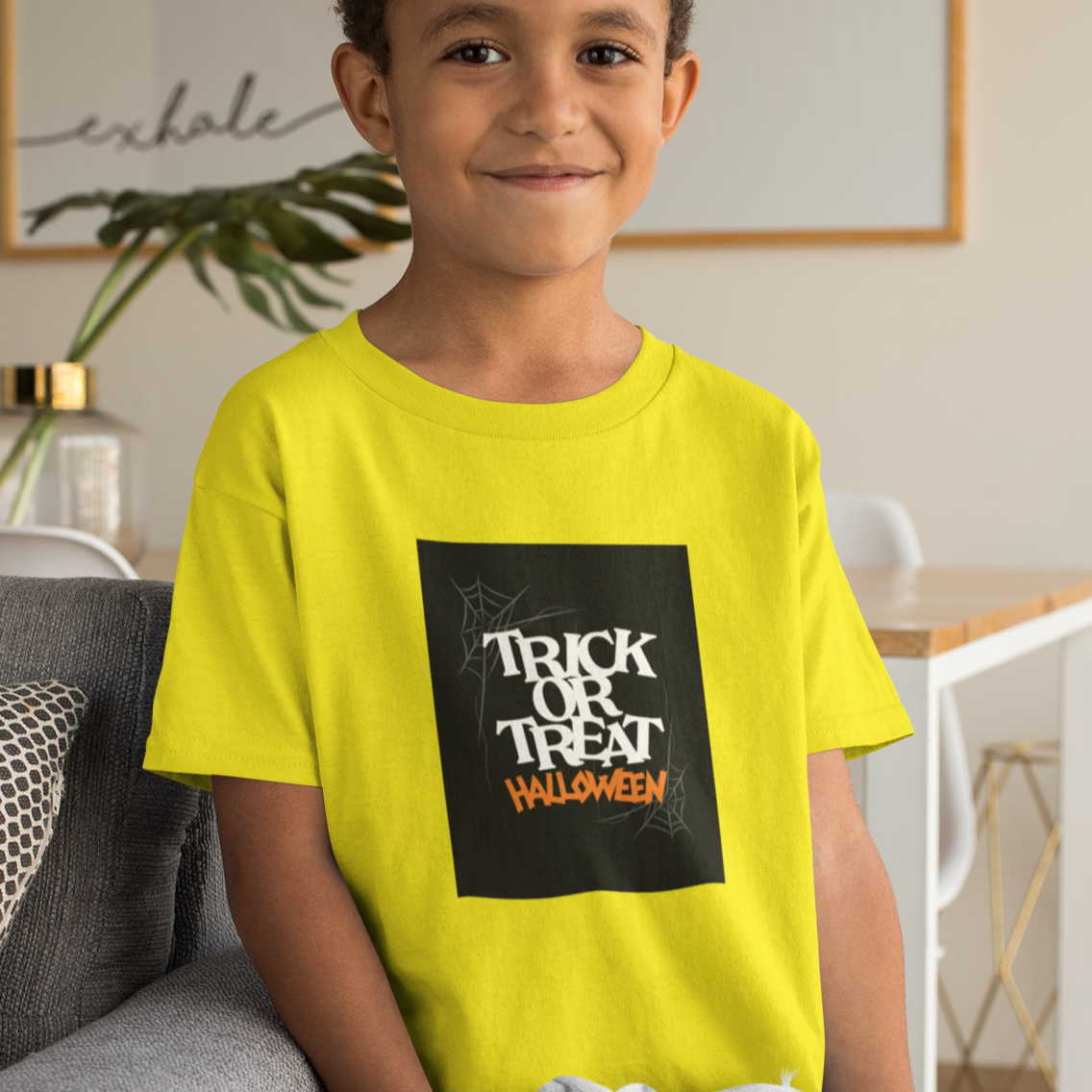Kids unisex cotton Halloween T-shirt with spider web print and text “Trick or Treat”