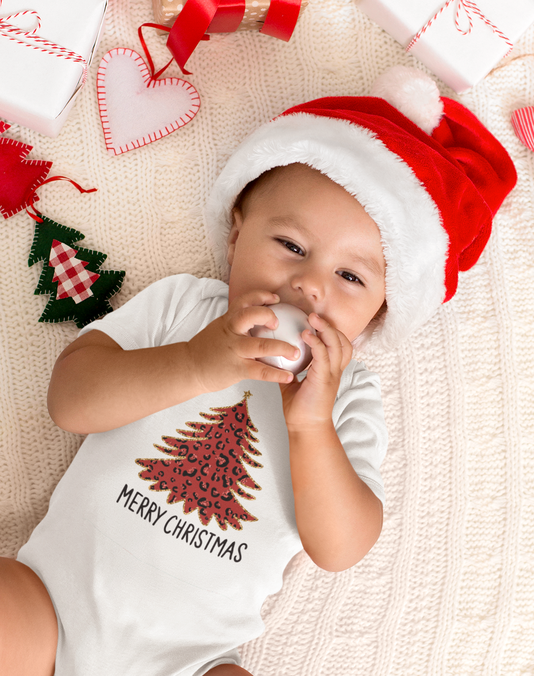 Cotton baby romper with red Christmas tree print saying Merry Christmas